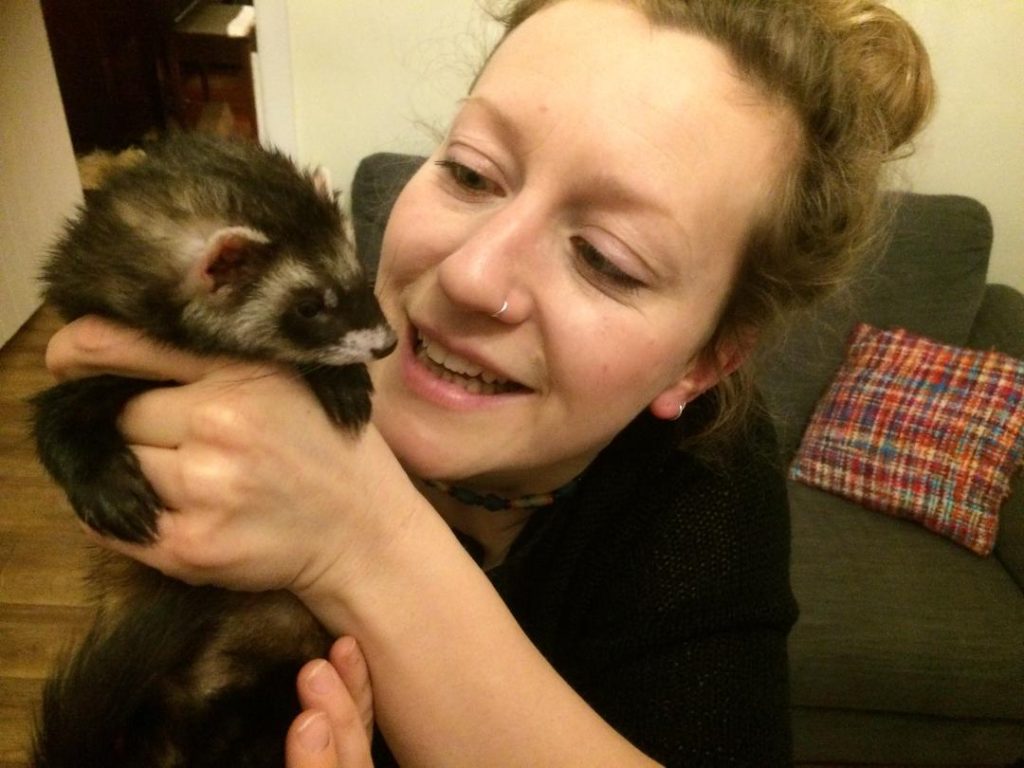 Picture of woman cuddling a ferret