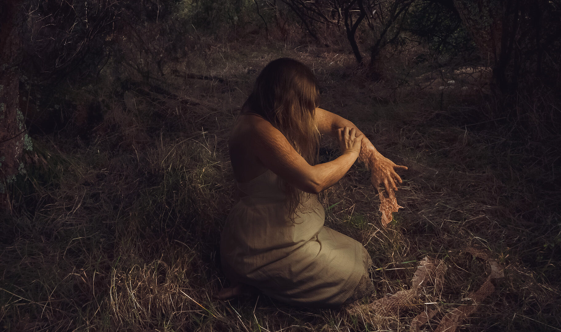 An image of what looks like a woman shedding her skin like a snake