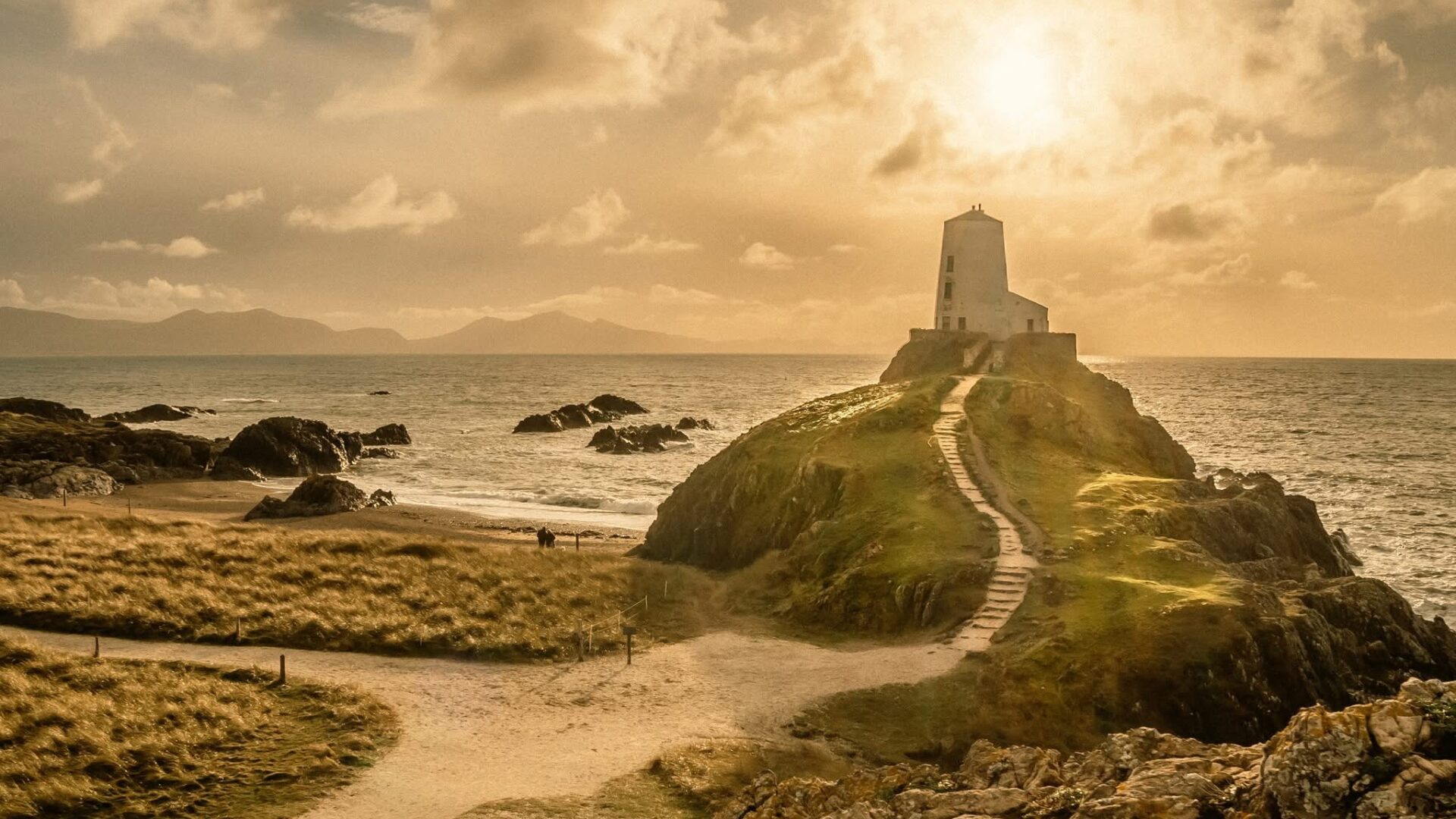 Golden light over a lighthouse on Anglesey.